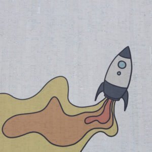 Kindergeschenk aus natürlichem Material Kork, Rakete auf einem Spielteppich aus Kork