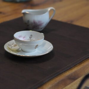 Porcelain on placemat, fine chocolate, high-quality, ecological placemat made from cork